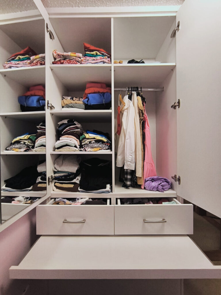 Custom wardrobe with high functionality - drawers, shelves, pull out desk, press and hanging area.